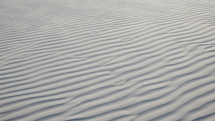 Fototapeta premium A serene landscape of rippled sand in a peaceful desert environment
