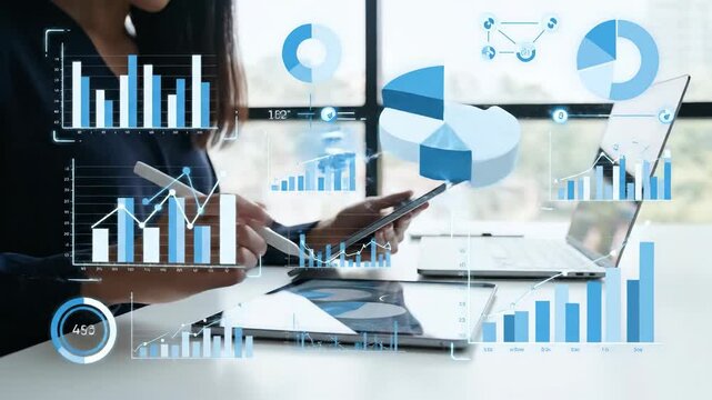 Business data analysis with charts and graphs on digital devices