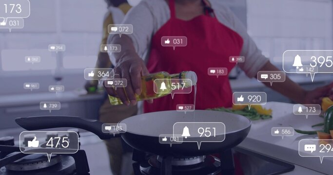 Pouring senior Black woman in red apron adding oil to frying pan in kitchen, livestream icons