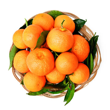 group of fresh tangerines in basket isolated