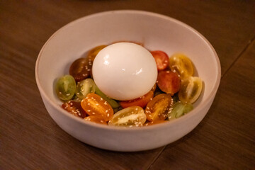 Burrata cheese salad served on plate