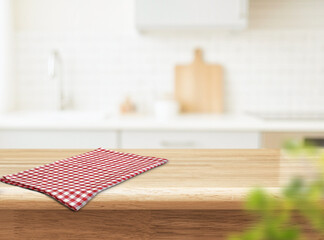 Wooden Kitchen Table with Red Checkered Cloth and Copy Space
