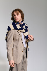 Stylish teenager showcases effortless fashion in a modern studio setting with vibrant energy