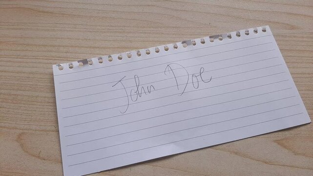 Handwriting the name John Doe