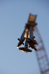 Close-up of industrial lifting chains and hooks used for equipment handling at an energy facility, ideal for: asset management, maintenance operations, industrial safety, energy infrastructure.