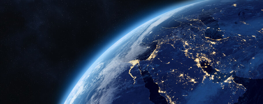 Earth planet in outer space. Asia. Night side on planet with cities lights. Near and Middle East, Central, West, South, East Asia at night viewed from space.