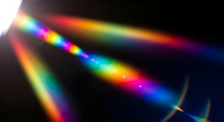 Vibrant rainbow light beams shining through darkness