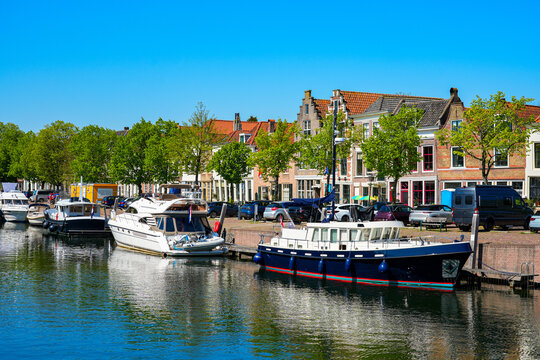 Scenic waterfront view of the historic harbor and traditional houses in Brielle, South Holland, the Netherlands