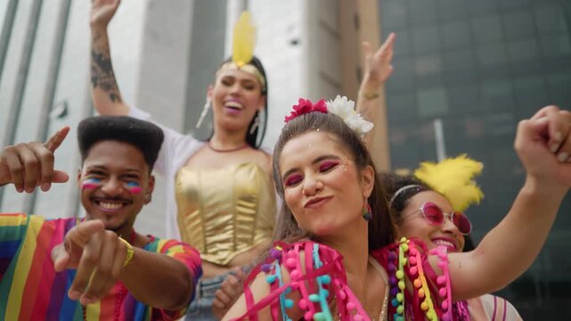 Cheerful Friends Celebrating at a Brazilian Carnival Street Party. Joyful Group in Colorful Costumes Laughing and Dancing During Vibrant Carnaval Festivities Outdoors