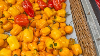 red and yellow peppers on the market