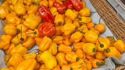 yellow peppers on a market stall