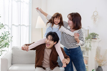 Family sharing joyful moments together in living room