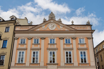Fototapeta premium Richly decorated building with ornaments and coat of arms at the Rynek Glowny in Krakow, Lesser Poland, Poland, Europe