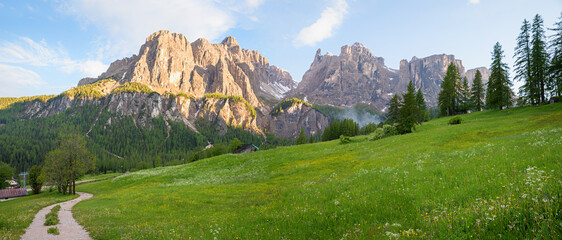 alpine landscape panorama Sella mountain with Mittagstal valley, green meadow