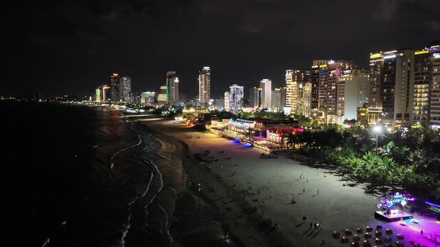 Night Aerial View of My Khe Beach and Coastal City Skyline with Neon Illumination in Da Nang Vietnam