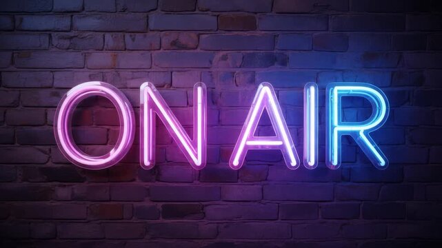 Neon on air sign glowing on dark brick wall background
