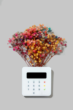 Credit card reader with colorful dried flowers