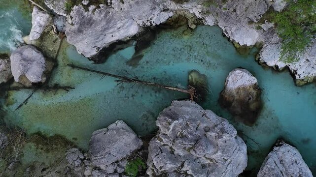 Turquoise river pools and wooden bridge aerial view