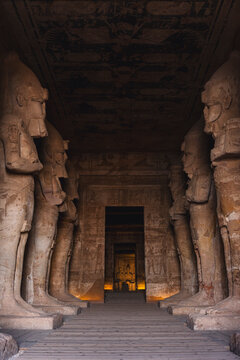 Statues in ancient Egyptian temple hallway