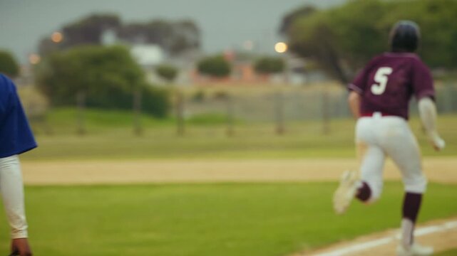 Baseball player scores a run during an intense game