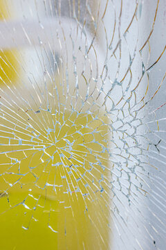 Close-up of shattered glass with abstract pattern