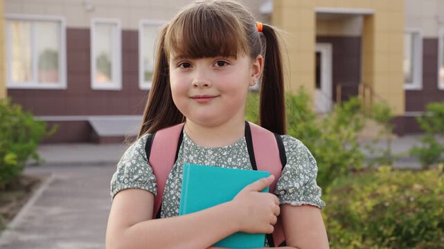 child kid girl backpack holding book, smile face, joyful education experience, positive attitude to education, knowledge is power, first day of school, child academic growth, academic aspirations