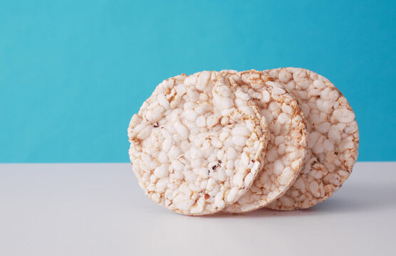 Round rice loaves on blue background