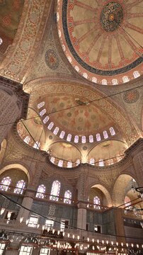 Istanbul,turkey,august 6, 2025. Interior view of the richly decorated domes and ceiling of the historic blue mosque in istanbul, turkey, with intricate calligraphy and patterns