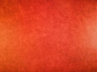 Fototapeta premium Vibrant Red Orange Grunge Texture Background - Dynamic red and orange textured background with a rustic, grunge effect. Ideal for web design, graphic projects, presentations, and artistic backdrops.