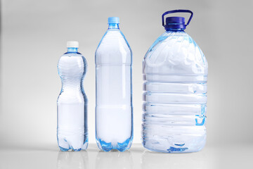 Fototapeta premium Water bottles of different sizes isolated on white