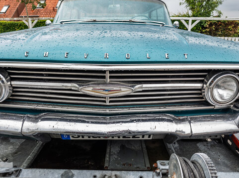 6 july 2025,Maribo, Denmark. Chevrolet impala, front view, turquoise color scheme with white hard top, hardtop sedan. Vintage car,rear view. Typical American classic car with a striking color. Nostalg