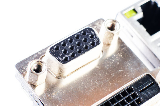 Close-up of a computer's VGA and DVI ports with metal connectors and pins