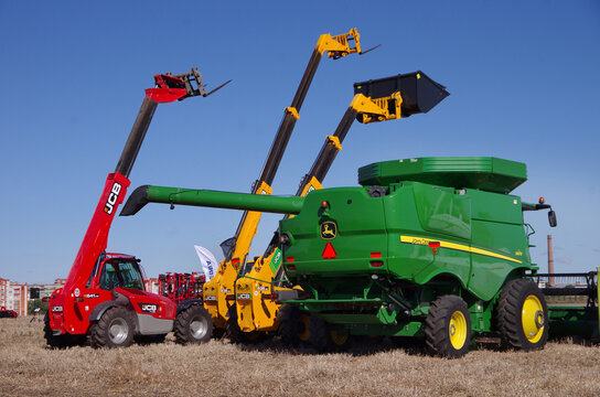 Baykivtsi, Ternopil region, UKRAINE - September 27, 2025: combine harvester and telescopic loaders at the exhibition of agricultural and construction machinery