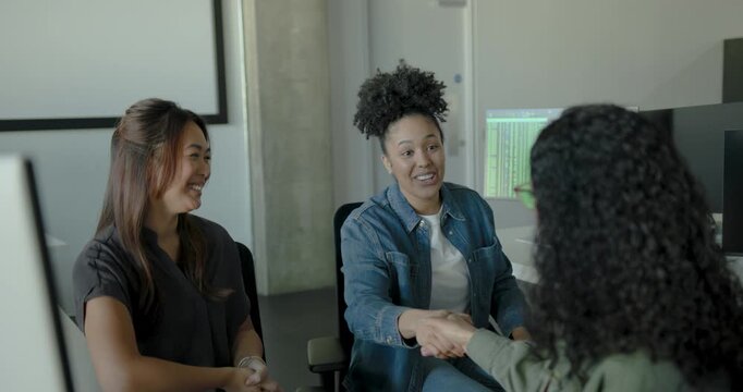 Business women in a modern workspace Welcoming New member to the office teaming Meeting in Office