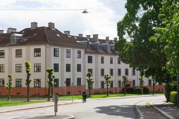 Historic Torshov Apartment Block in Oslo Norway with Iconic Curved Facade Pollarded Trees and Traditional Nordic Classicism Architecture in Residential District