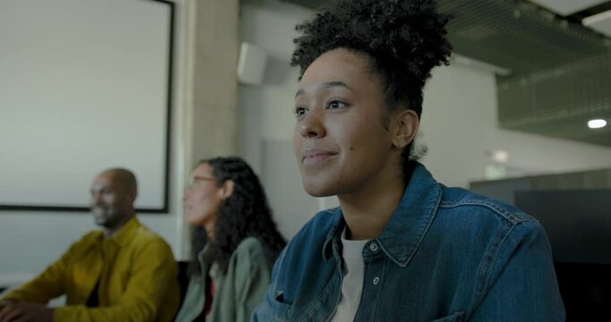 Focused businesswoman working at her desk in a modern workspace office