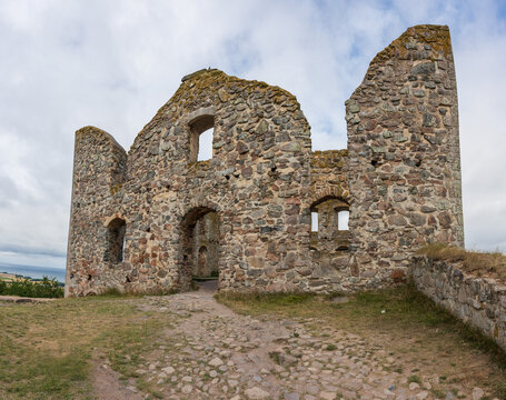 Gr?nna, Sweden - August 04 2025: Historic Brahehus stone castle ruins on grassy hillside.