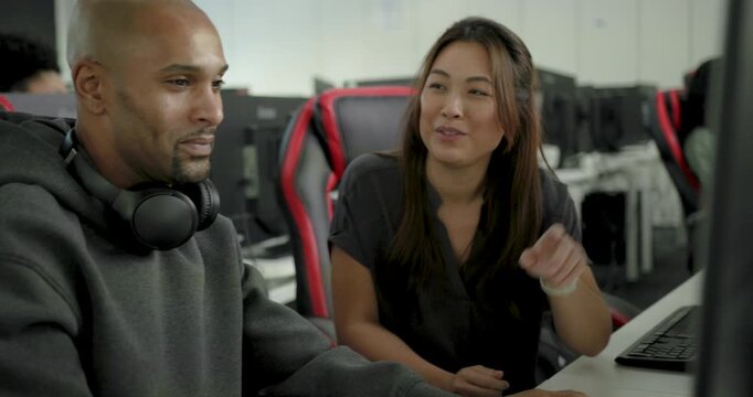 Game developers Collaborating and Sharing Ideas at Work