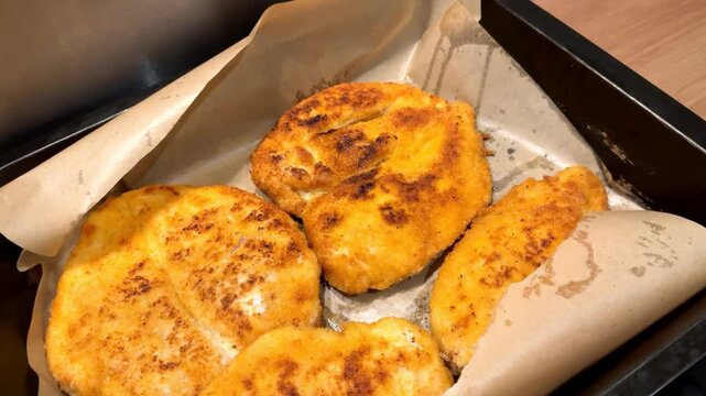 Breaded fried meat on a baking sheet. Home cooking, Breaded chicken
