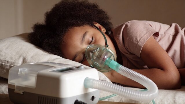 A person sleeps peacefully in bed with a CPAP machine and mask connected. The image conveys themes of sleep apnea treatment, respiratory health, and medical care.