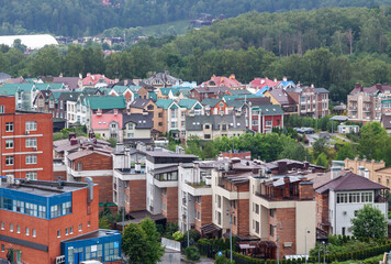 Fototapeta premium Eco friendly suburban housing area surrounded by forest