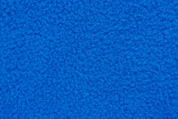 Bright blue fleece fabric texture for warm clothing and hobby sewing projects