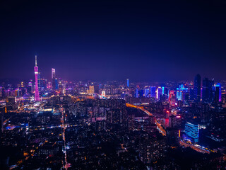 Obraz premium Aerial night view of illuminated Guangzhou skyline with skyscrapers and city lights, travel China