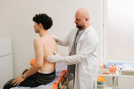 Kidney tenderness assessment during physical exam by urologist.