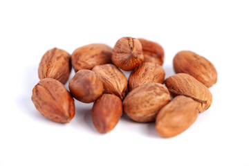 Hazelnuts kernels on a white background, healthy food. Macro