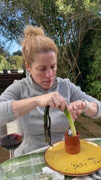 People Eating Cal&ccedil;ots at Outdoor Cal&ccedil;otada Event in Spain