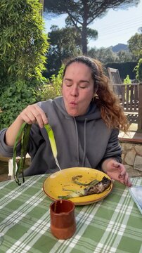 People Eating Cal&ccedil;ots at Outdoor Cal&ccedil;otada Event in Spain