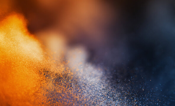 Abstract swirl of vibrant orange and blue colors, creating a dynamic and energetic visual effect.