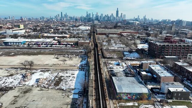 Cinematic 4K Drone Aerial Chicago Skyline Flying to Downtown Over CTA Green Line 'L' Train Tracks in Garfield Park