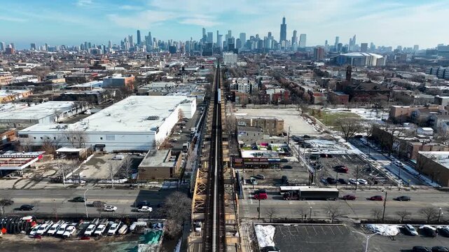 Cinematic 4K Drone Aerial Chicago Skyline Flying to Downtown Over CTA Green Line 'L' Train Tracks in Garfield Park